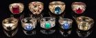 Nine Men's 14K Yellow Gold Rings. Including One with Two .40 Carat Diamonds and Two with Fine Blue Star Sapphires