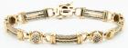 Lady's 14K Yellow Gold and Cable Bracelet with Oval Links Studded with Accent Diamonds