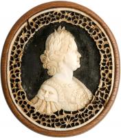 Peter the Great. Walrus ivory cameo cutout on a black field, ivory lattice border.