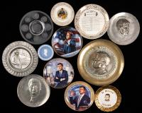 John F. Kennedy Collection: Collection of 11 Glass or Porcelain Commemorative Plates Plus Two in Pewter and One in Brass