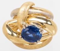 Lady's Large, 18K Yellow Gold Ring, Free-Form Design Centered with a Synthetic Oval Sapphire