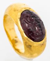 Roman, 1st Century AD, Child's 22K Gold Ring inset with a cabochon Garnet Intaglio