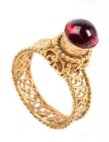 5th Century Byzantine 23K Gold Ring Boasting a Striking, Raised Garnet Cabochon Surrounded and Supported in Detailed Scroll Work