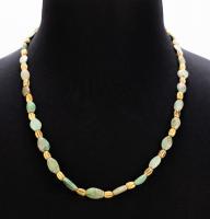 1st Millennium B.C., Greenstone and High Karat, Melon-Shaped, Yellow Gold Bead Necklace