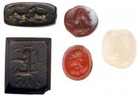 Sasanian Period 5-Piece Lot of Intaglio Seals, 5th to 8th Century A.D: Three Piece Set w/ Human Portraits and Two Animal Stamp S