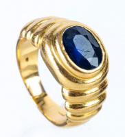 Lady's 14K Gold Ring Centered with a Deep Blue Oval Sapphire