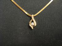 Lady's 14K Yellow Gold and Diamond, Open "S" Swirl Halo Pendant on a 14K Yellow Gold, 27" Chain