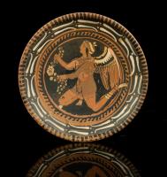 Apulian Red Figured Footed Plate with Winged Eros Holding Garland