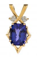 Exceptional Ladies 14K Yellow Gold pendant with a 6.28 Carat Oval Tanzanite Accented with Two (2) 10 pt. Diamonds