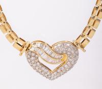 Ladies 18K Yellow Gold Necklace Centered with a Heart set with Diamond Baguettes and Accent Diamonds