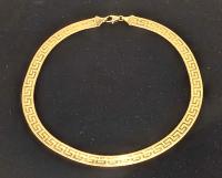 Ladies 14K Yellow Gold Italian Flat Herringbone Style Flat Necklace with a Greek Key Design Throughout.