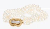 Ladies Lovely Double Strand of Cultured Pearls Enhanced by a Beautiful 18K Yellow Gold and Diamond Clasp Usually Worn to the Sid