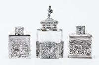 Two (2) Spectacular Sterling Silver Tea Caddies with Exceptional Repousse Work. The Etched Glass with 800 Silver Caddy is a Priz