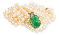 Lustrous Graduated Double Strand of Freshwater Pearls, 26" in Length with a 14K Yellow Gold Clasp with Jade Carving