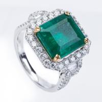 Exquisite Ladies 4 Carat Zambian Emerald Surrounded in a Halo of 2 Carats of Diamonds in a Well Designed, 18K White Gold Mount.