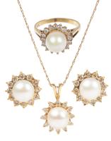 Ladies 14K Yellow Gold and Pearl Ensemble Including Ring, Pendant and Earrings all with a Halo of White Accent Diamonds.