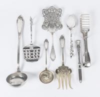 Eight Large 800 Silver Serving Pieces Including a Heavy Ladle, Asparagus Tongs, Two Pastry Tongs, A Serving Fork, Strainer and a