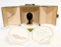 The Theo FabergÃ© Scribes Egg: Presentation Writing Instrument and Egg Stand made of Rare Wood and 24K Gilt Gold