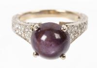 Ladies Mint 18K White Gold Star Ruby Cabochon Ring with Pave Diamonds Set the Entire Length of the Shanks.