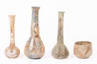 Collection of Four Roman Glass Vessels Including Tall Unguentaria and Small Bowl