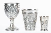 Two Sterling Silver Aztec/Mayan Themed Vessels: Stemmed Goblet and Cup and One Peruvian Shot Glass