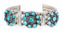 Ladies Sterling Silver and Turquoise Cuff with a Floral Motif