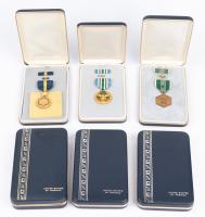 Six Military Medals Including: The US Navy Distinguished Service Medal and the US Army Commendation Medal