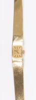 Ladies Solid 14K Yellow Gold Wrist Watch by Omega with Sleek Snakeskin Style Band