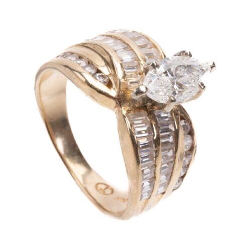 Ladies Engagement Ring Boasting a .90 Carat Marquis Diamond with Accent Baguettes and Round Brilliant Cut Diamonds Totaling One