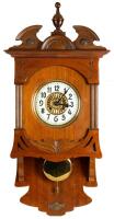 Vintage Wall Clock with Fine Cabinet Work and a Gleaming Clock Face