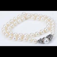 Elegant String of White Pearls with a 14K White Gold and Diamond Clasp