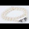 Elegant String of White Pearls with a 14K White Gold and Diamond Clasp