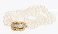 Ladies Lovely Double Strand of Cultured Pearls Enhanced by a Beautiful 18K Yellow Gold and Diamond Clasp Usually Worn to the Sid
