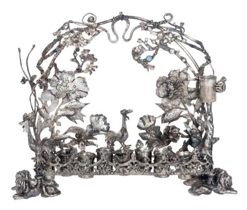 Appealing, Late 19th Century Menorah, 800 Silver with an Explosion of Birds, Vines, Foliage and Blossoms Forming an Arch Over th