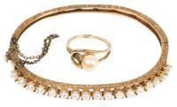 Vintage 14K Yellow Gold Hinged Bracelet with 17 Tiny Pearls Prong Set Along the Top. Complimenting is a 14K Yellow Gold and Pear
