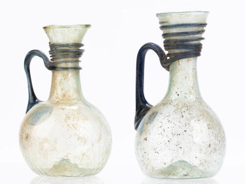 Matched Pair of Roman Translucent Green and Cobalt Blue Glass Juglets ca. 3rd-4th Century A.D.