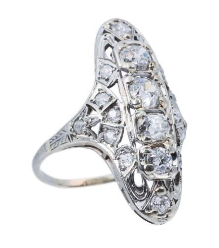 Antique Platinum Ring Boasting Old European Cut Diamonds in an Art Deco Shield Style Ring.