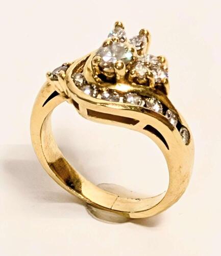 Ladies Petite Diamond Ring in a Lovely Floral Design. Combination of Round Brilliant Cut and Marquis Diamonds in 14K Yellow Gold
