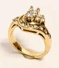 Ladies Petite Diamond Ring in a Lovely Floral Design. Combination of Round Brilliant Cut and Marquis Diamonds in 14K Yellow Gold