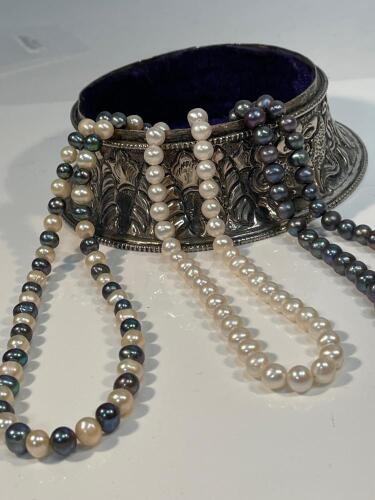 Three Cultured Pearl Necklaces, One in White Pearls, One of Black Pearls and One in Alternating White and Black