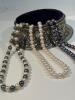 Three Cultured Pearl Necklaces, One in White Pearls, One of Black Pearls and One in Alternating White and Black