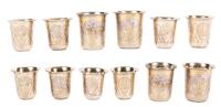 6 Small 84 silver Kiddish Cups Including a Fine Set of Four Impeccably Engraved Cups in Gilt Gold and a Pair From the Same Silve