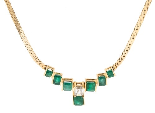 Exceptional Emerald and Diamond Necklace in 14K Yellow Gold Herringbone Chain with 7 Channel Set Emeralds and a Beautful