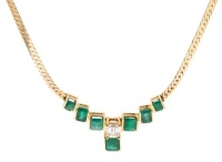 Exceptional Emerald and Diamond Necklace in 14K Yellow Gold Herringbone Chain with 7 Channel Set Emeralds and a Beautful