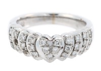 Ladies 18K White Gold Ring with Heart Shaped Center Studded with Accent Diamonds.