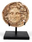 GREEK HELLENISTIC. Ivory roundel with facing head of Gorgon. 4th-3rd century BC.