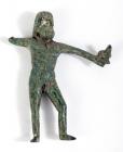 ROMAN. Bronze statuette of Jupiter holding eagle in outstretched hand. Ca. 2nd-3rd century AD.