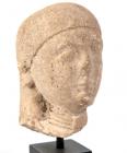 PROTO-CYPRIOT. Limestone head of a female votary. Ca. 560-540 BC