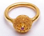 22 Kt. Gold Ring with Delicate Granulation and Central Garnet