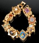 Beautiful Lady's 14K Bracelet of 8 Charms of Different Designs with Semi-Precious Stones